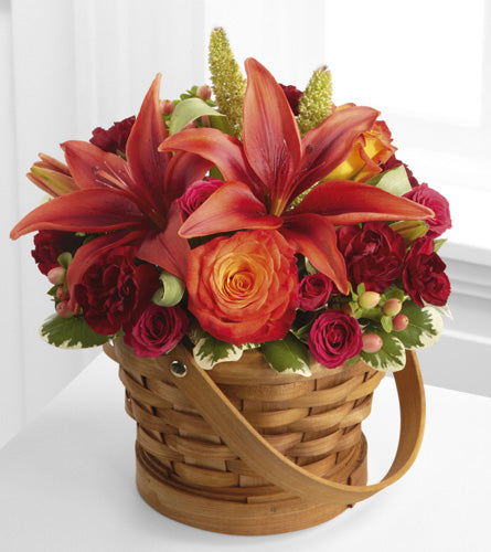 Abundant Harvest Basket - arrangement of flowers in a woven handled basket.