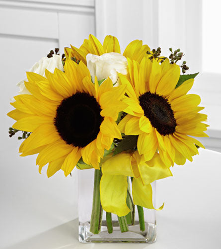Perfect Sun Bouquet - Bouquet of sunflowers and white roses in a clear glass vase with a yellow bow.