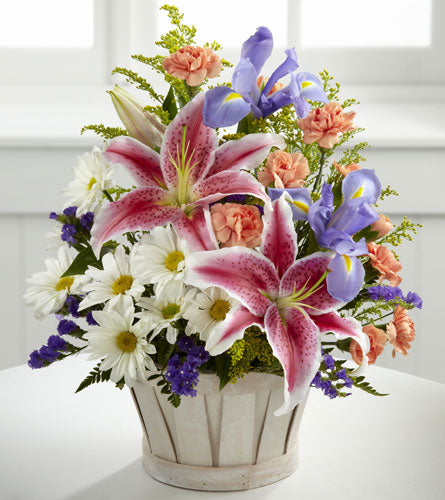 Wondrous Nature Bouquet - colourful flower arrangement in a white basket.