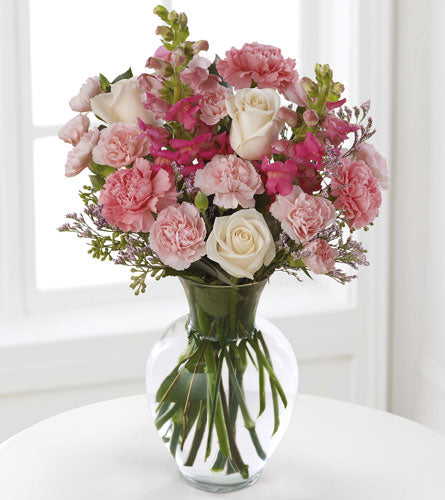 FTD's Love In Bloom Bouquet - arrangement of pink and white flowers in a clear vase.