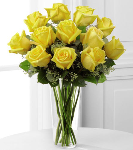 Yellow Rose Arrangement - Bouquet of twelve yellow roses in a clear vase.