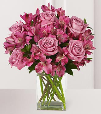 Purple Passion Bouquet - pink roses, alstroemeria and lilies n a clear glass vase.