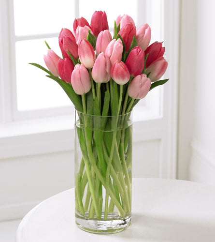 FTD's Premium Tender Tulips Bouquet - arrangement of pink tulips in a clear glass vase.