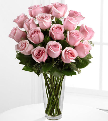 FTD's Deluxe Pink Rose Arrangement - bouquet of eighteen pink roses in a clear vase.
