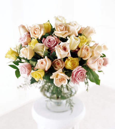 FTD's Display of Affection Arrangement - bouquet of pastel-colored roses in a clear vase.