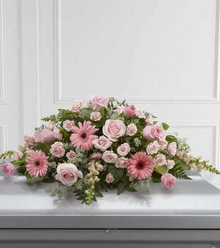 Sweet Farewell Casket Spray - floral arrangement with pink and white flowers.