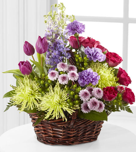 Truly Loved Basket - colourful flower arrangement in a wicker basket.