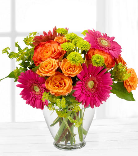 End of the Rainbow - bouquet of colourful flowers in a clear vase.