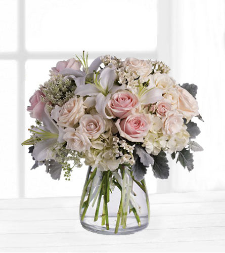 Beautiful Whisper - bouquet of pink and white flowers in a clear vase.