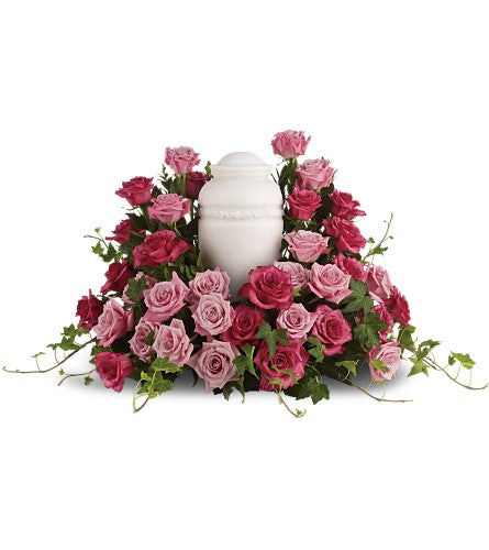 Bed of Pink Roses - white urn surrounded by pink and lavender pastel roses.