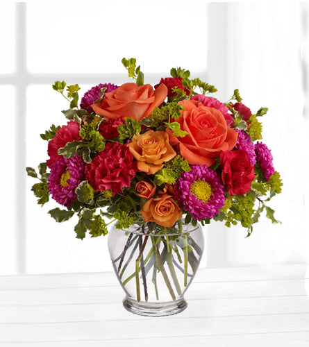 How Sweet It Is - colourful flower bouquet in a clear glass vase.