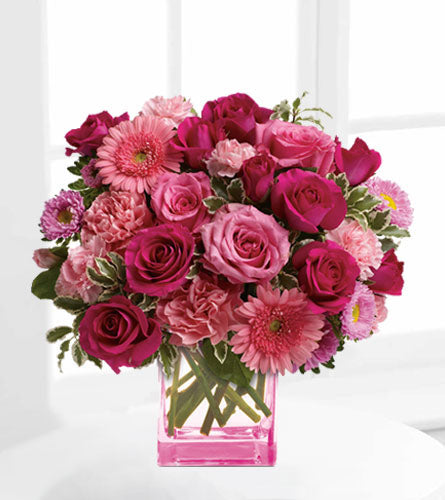 Pink Dreams Bouquet - arrangement of mixed pink flowers in a pink cube vase.