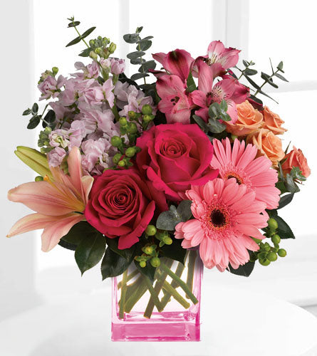 Teleflora's Painterly Pink Bouquet - mixed colourful flowers arranged in a pink cube vase.