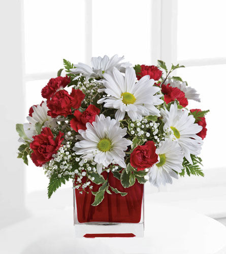 Red and White Delight - red mini carnations and white daisies arranged in a red cube vase.