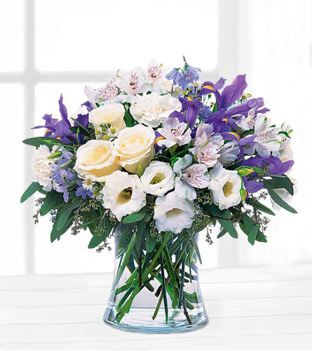 Teleflora's Blissful Bouquet - floral arrangement of mixed flowers in a clear vase.