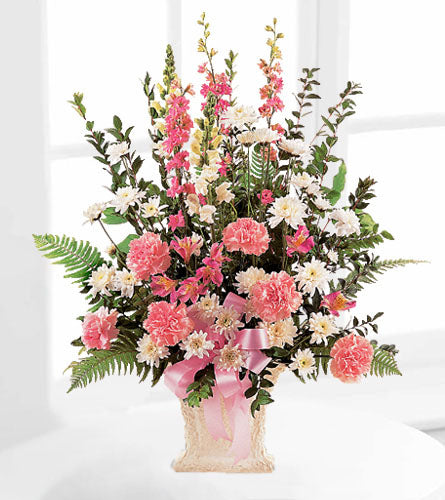 Sweet Sentiments - floral arrangement with pink and white flowers in a woven basket.