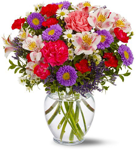 Pink and Purple Inspiration - bouquet of colourful flowers in a clear vase.