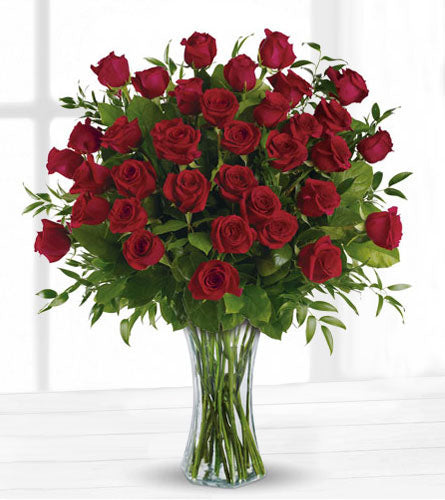 Breathtaking Beauty - arrangement of three dozen red roses in a clear vase.