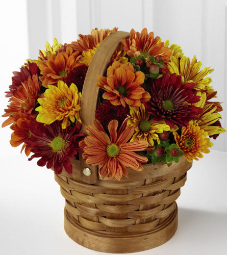 Woodland Wonder Basket - wicker basket filled with autumn-themed flowers.
