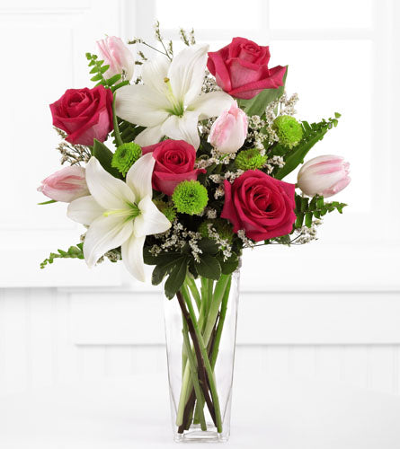 Floral Expressions by Better Homes & Gardens - pink roses, tulips, and white lilies in a clear vase.