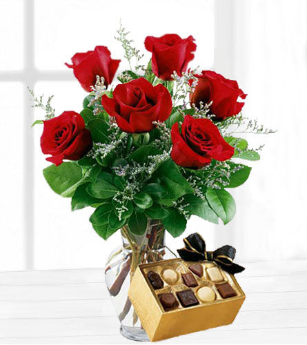 Six Red Roses with Large Chocolates - bouquet of six red roses, babies breath and greens with a large box of chocolates.