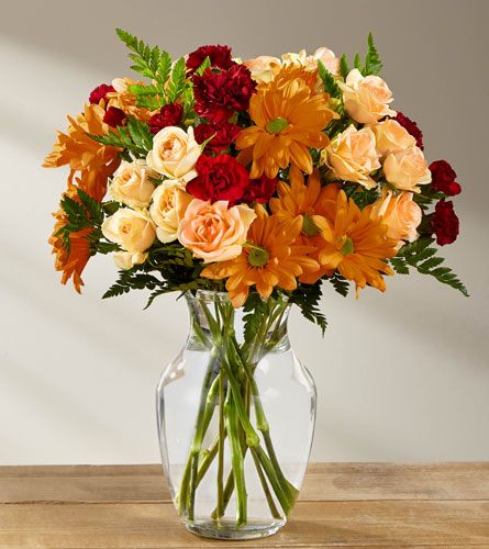 Golden Autumn - bouquet of autumn flowers in a clear glass vase.