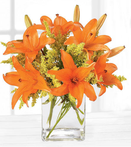 FTD's Tigress Bouquet - arrangement of orange lilies in a clear glass vase.