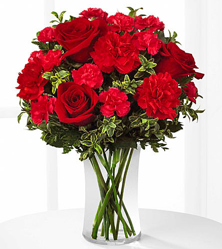 Always True Bouquet - red roses and carnations in a clear glass vase.