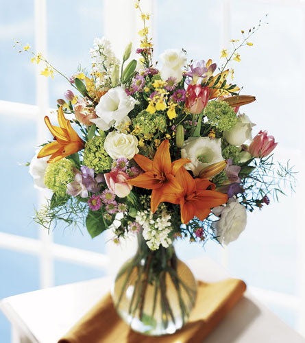 FTD's Daylight Arrangement - Bouquet of mixed flowers in a clear vase.