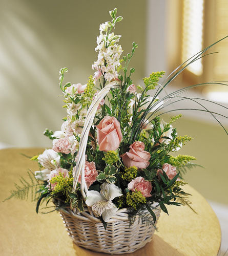 Blushing Beauty Basket - floral arrangement of pink and white flowers in a wicker basket.