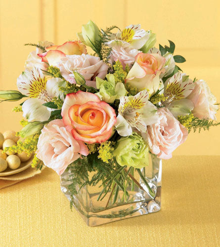 Speak Softly Bouquet - arrangement of flowers in a clear glass cube.
