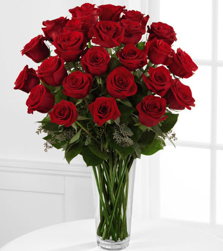 Premium Red Rose Arrangement - Bouquet of twenty four red roses with greenery in a clear vase.