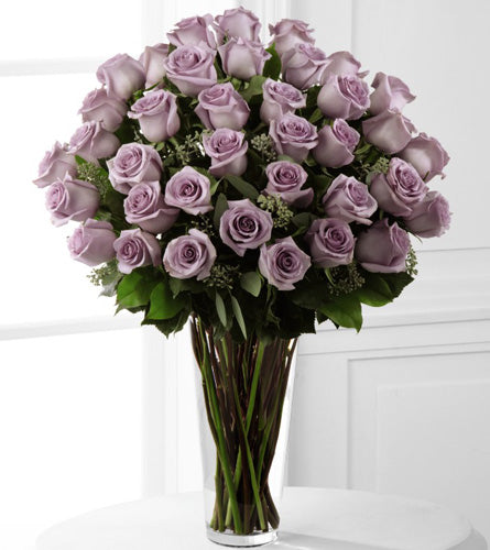 Exquisite Lavender Rose Bouquet - three dozen lavender roses in a clear glass vase.