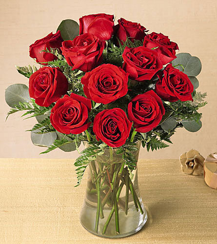 Blooming Masterpiece Bouquet with Eucalyptus - arrangement of twelve red roses and eucalyptus in a clear vase.