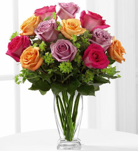 FTD's Pure Enchantment Rose Bouquet - arrangement of colourful roses in a clear glass vase.