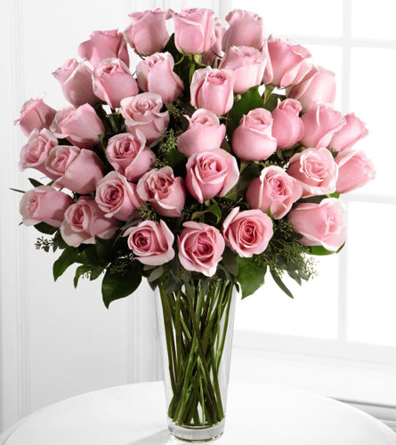 Exquisite Pink Rose Bouquet - floral arrangement of three dozen pink roses in a clear glass vase.