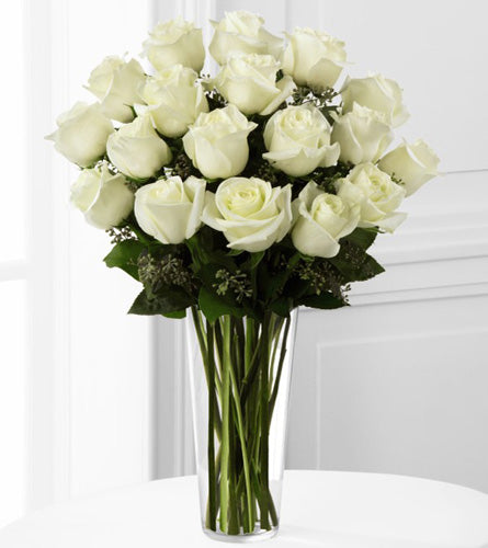 Deluxe White Rose Bouquet - floral arrangement of white roses in a clear glass vase.