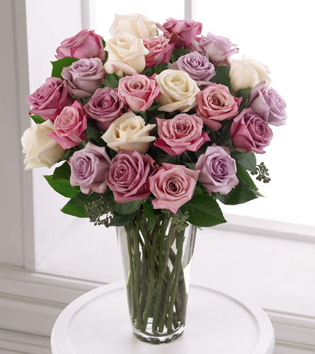 Premium Pastel Rose Bouquet - two dozen pink, white, lavender and purple roses in a clear glass vase.