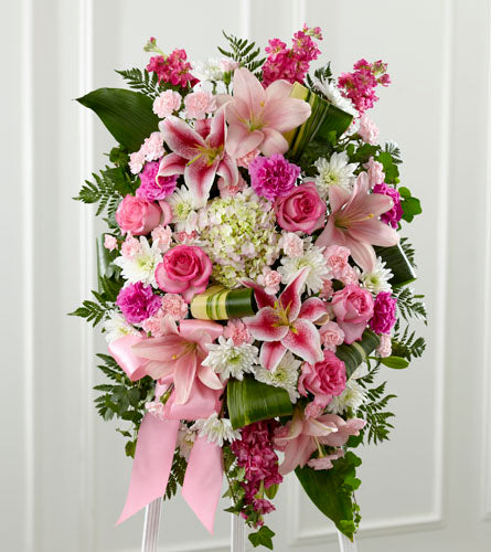 Gentle Standing Spray - funeral design of pink and white flowers with greenery displayed on an easel.