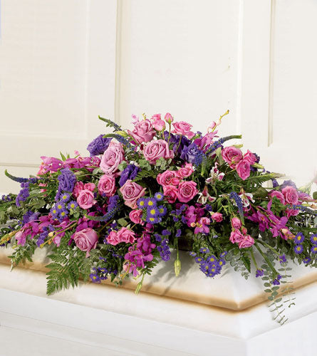 Blanket of Flowers Casket Spray - Colourful floral arrangement.