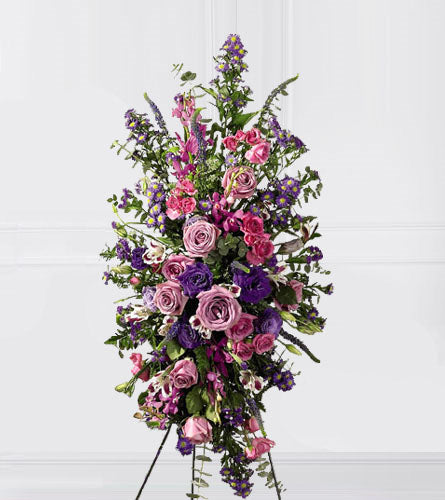 Blessings of the Earth Easel - floral arrangement with pink, purple, and green flowers on a stand.
