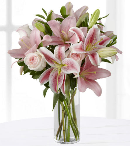 Pretty in Pink Bouquet - pink lilies and pink roses with greenery in a clear glass vase.