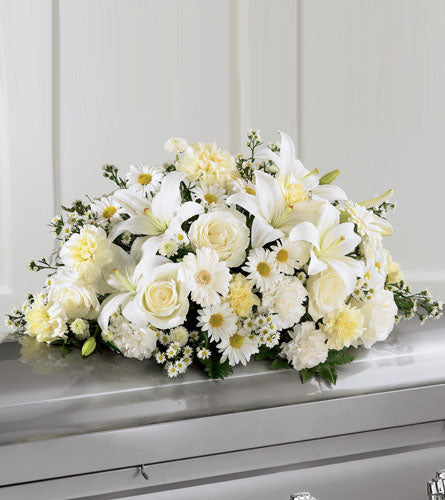 Sweet Peace Casket Spray - Bouquet of white and yellow flowers.