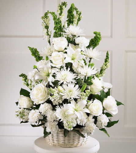 Eternal Light Arrangement - arrangement of white flowers in a woven basket.