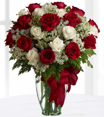 Love's Divine - Two Dozen Roses - Bouquet of two dozen red and white roses with a clear vase and red ribbon.