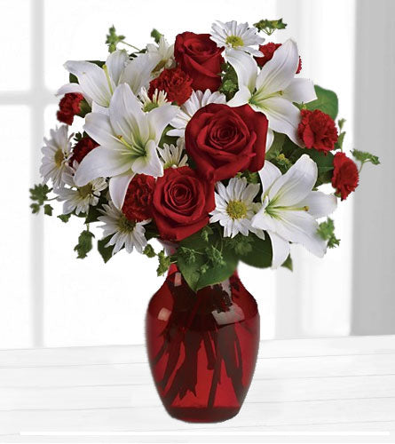 Teleflora's Be My Love - bouquet of red and white flowers in a red vase.