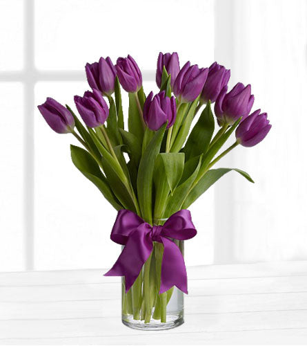 Passionate Purple Tulips - bouquet of purple tulips in a clear vase with a purple ribbon.