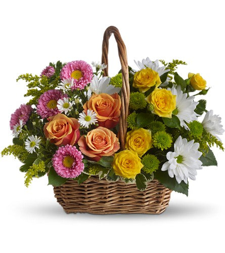 Sweet Tranquility Basket - floral arrangement in a brown woven basket with a variety of colourful flowers.