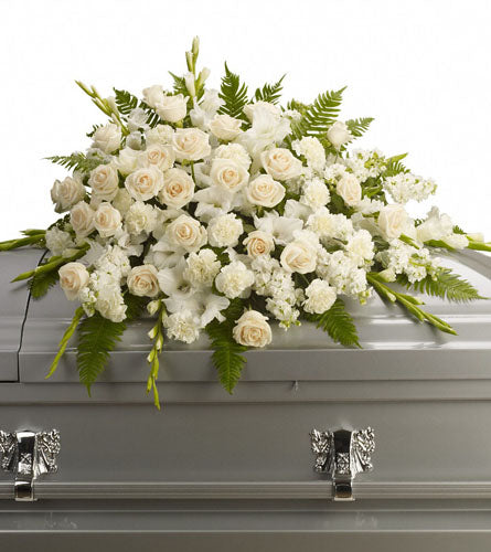 Silken Serenity Casket Spray - White floral arrangement with roes and carnations.