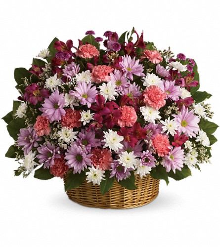 Rainbow Reflections Basket - arrangement of colourful mixed flowers in a woven basket.